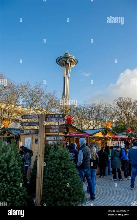 Seattle Christmas Market scene with vendors and the Space Needle at the ...