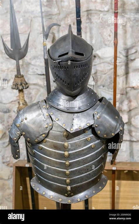 Gallery of knight's armor. Knight's iron armor in the museum. toned Stock Photo - Alamy