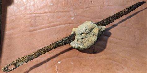 Sword in Stone? I found this after a large storm washed the beach away near Santa Barbara ...