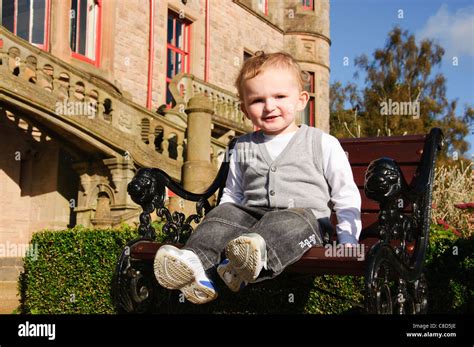 a young child posing for portrait around belfast castle northern ireland Stock Photo - Alamy