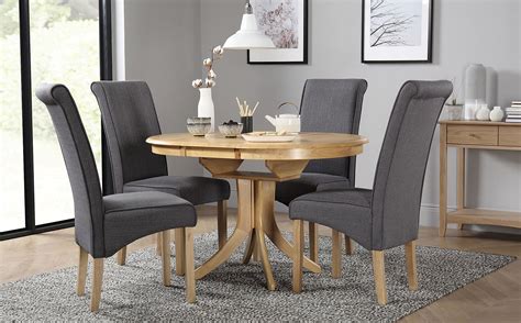 Hudson Round Oak Extending Dining Table with 6 Stamford Slate Fabric Chairs | Furniture Choice