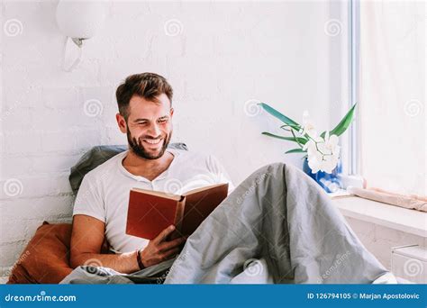 Young Man Reading a Book in the Bed Stock Image - Image of happy ...