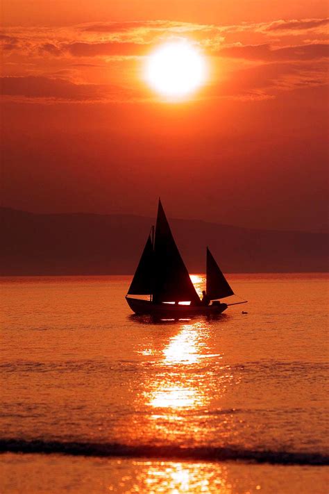 Sailing Ships in a Stunning Sunset