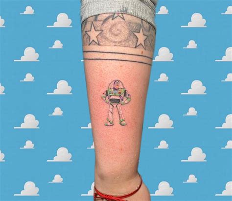 Buzz Lightyear tattoo located on the forearm.