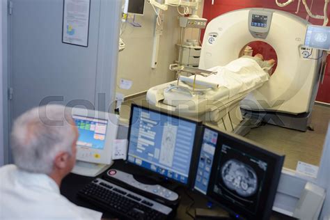 MRI technician surveying the process | Stock image | Colourbox