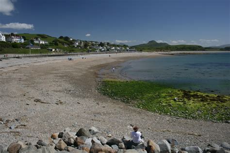 Enjoying a sunny day on Criccieth beach Photo | UK Beach Guide