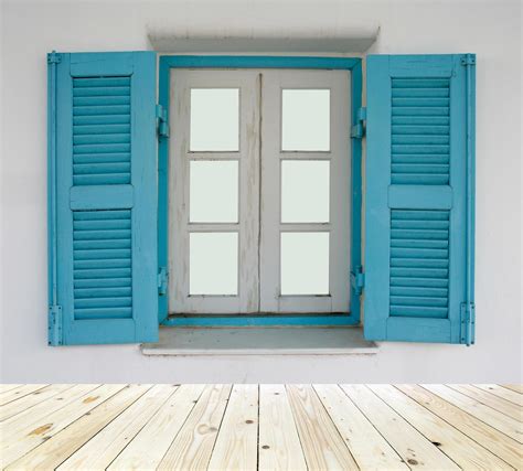 Blue shutters on window 1965111 Stock Photo at Vecteezy