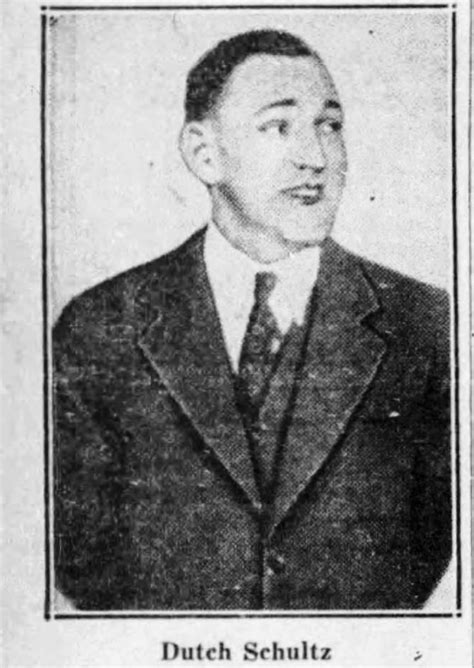 an old black and white photo of a man in a suit with his eyes closed