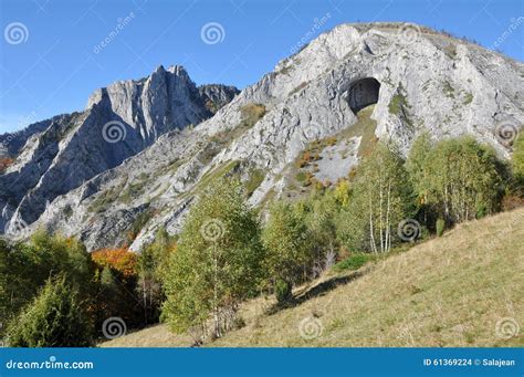 Mountain with a Big Cave Entrance Stock Photo - Image of beautiful ...