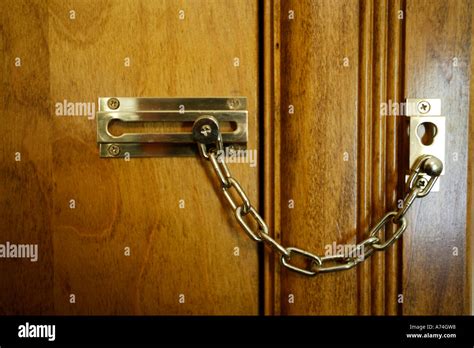 Locked Door with Chain Lock Stock Photo - Alamy