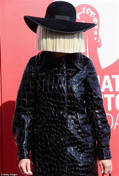 Sia conceals her face with wig and bow headpiece at Venice Film Festival | Daily Mail Online