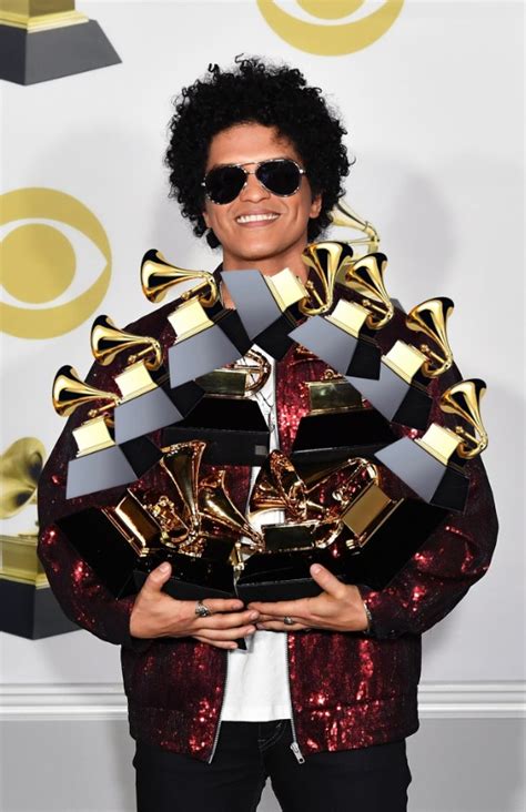 PHOTO Bruno Mars Holding All 13 Of His Grammy Awards