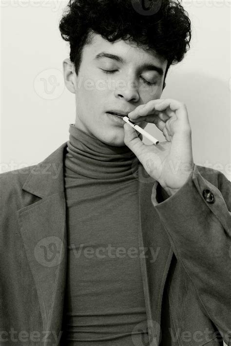 And man portrait black sitting smoking cigarette fashion white 26409485 Stock Photo at Vecteezy