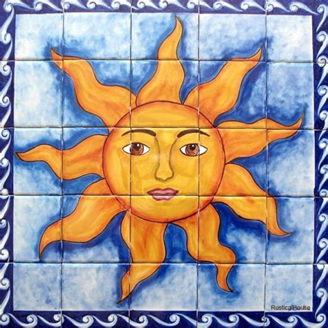 a sun painted on the side of a tile wall