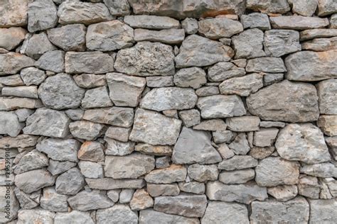 Stone wall texture background - grey stone siding with different sized stones Stock Photo ...