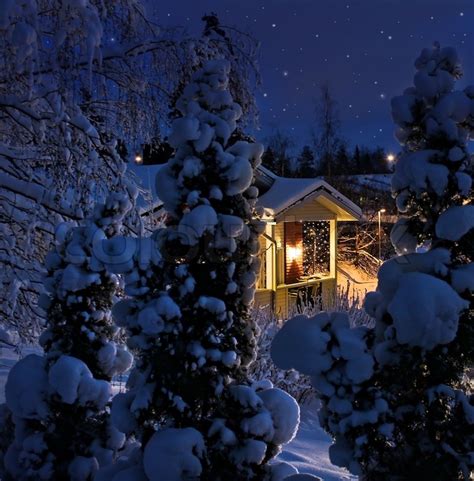 Illuminated house on snowy Christmas ... | Stock image | Colourbox