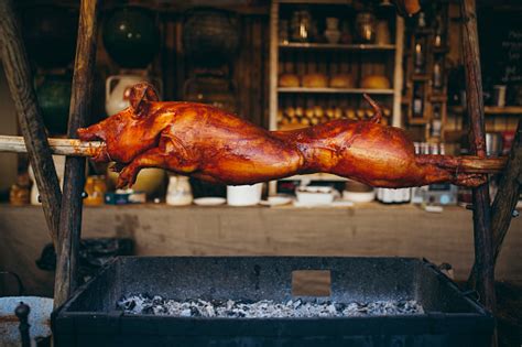 Pig Is Roasting On A Spit Stock Photo - Download Image Now - iStock