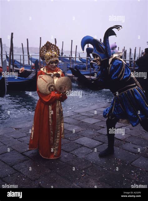 Carnival characters by the Grand canal Venice carnival Italy Stock Photo - Alamy