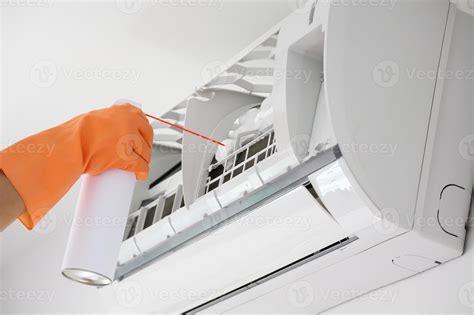 air conditioner cleaning with spray foam cleaner 12926037 Stock Photo at Vecteezy