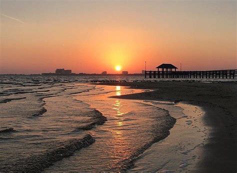 A stunning beach sunset in Ocean Springs, Mississippi on the Mississippi Gulf Coast. # ...