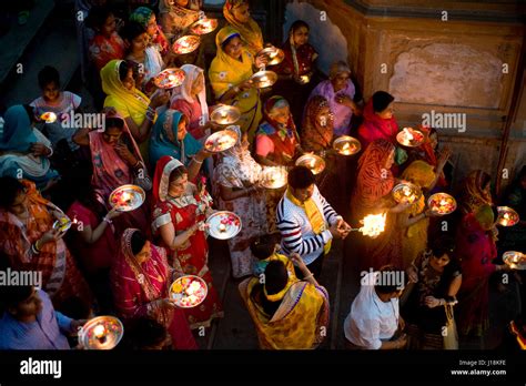 People holding aarti, yamuna river, vrindavan, uttar pradesh, india ...