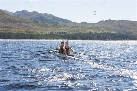 Double scull rowing boat in water - Stock Image - Everypixel