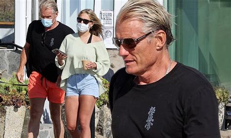 Dolph Lundgren, 62, and fiancee Emma Krokdal, 24, enjoy a romantic afternoon stroll in Malibu