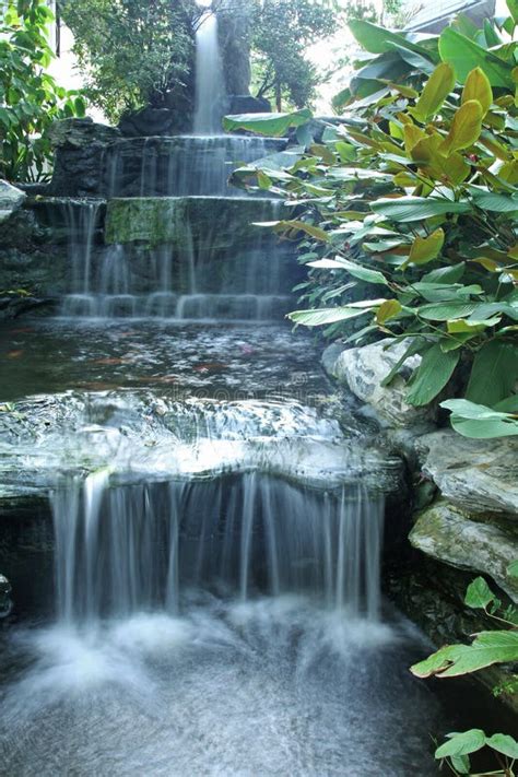 Waterfall Over The Green Rock And Garden Royalty Free Stock Photography ...