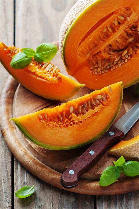 Sweet fresh melon on the wooden table, selective focus | Delicious fruit, Food, Food photography