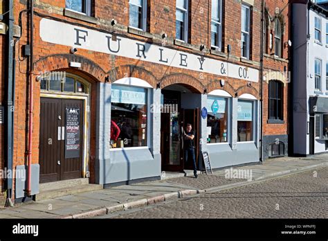 Man exiting Furley & Co, a bar on Princes Dock Street, Hull, East ...