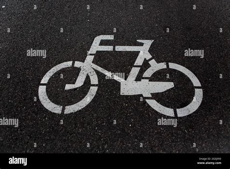 Bicycle road sign on road Stock Photo - Alamy