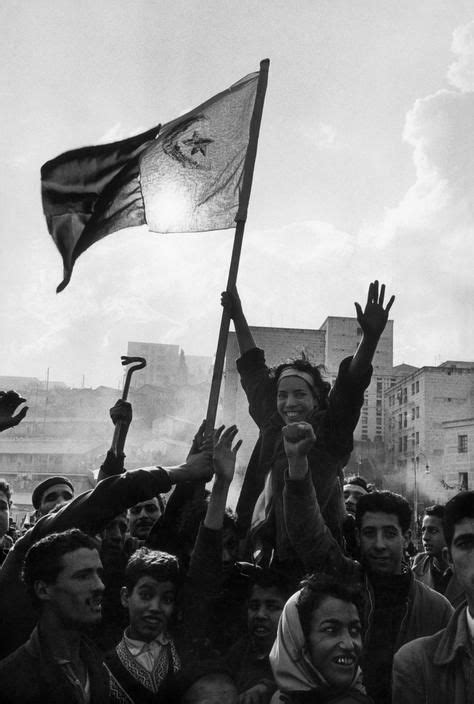 Algeria. Algiers. A group of young demonstrators raise fhe FLN flag ...