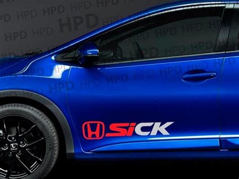 the side view of a blue honda civic hatchback with stickers on it's sides