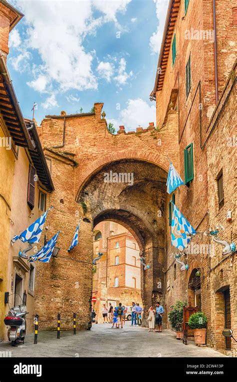 SIENA, ITALY - JUNE 22: Walking in the picturesque streets in the ...