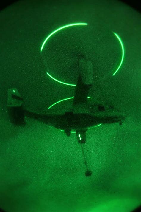 An MV-22 Osprey aircraft supports Marine Helicopter Support Team during slingload operations on ...