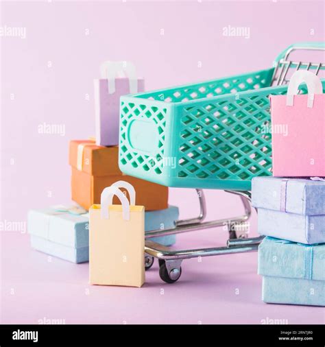 Grocery cart with colourful gift boxes Stock Photo - Alamy