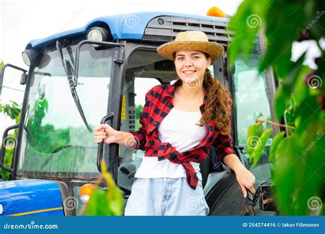 Girl Farmer Working on a Tractor at a Orchard Stock Photo - Image of ...