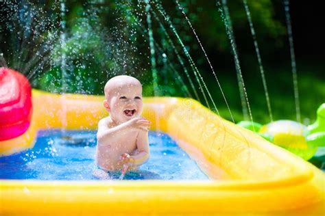 Happy Baby Playing In Swimming Pool Stock Image - Image of hose, caucasian: 71927761