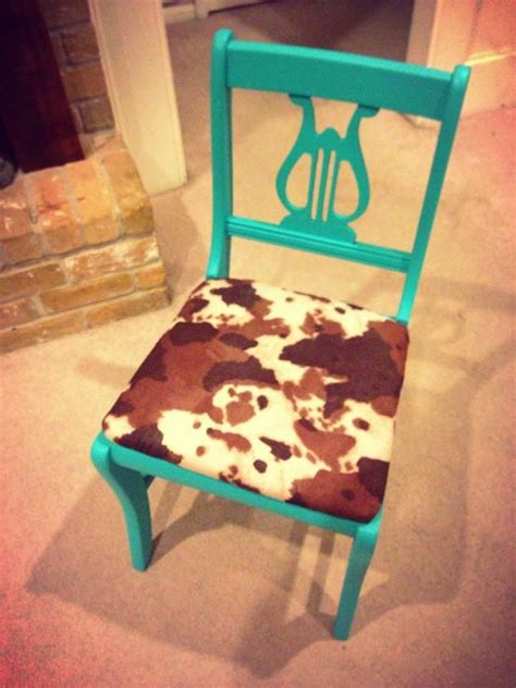 Redid an old chair! Painted it turquoise and added cowhide to the seat! Absolutely love how it ...