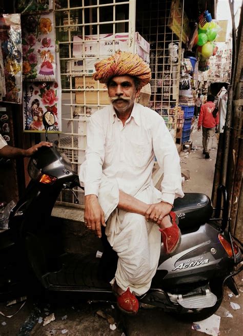 63 year old Rajasthani man wearing a classic attire with white kurta ...