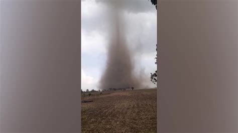 Large tornado forms over rice field and destroys houses in the Philippines