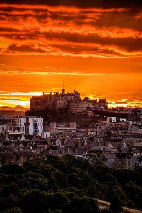 Edinburgh Castle bathed in an orange sunset. | Travel around the world, Places to visit ...