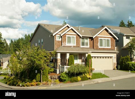 new beautiful suburban house with blue sky and clouds Stock Photo - Alamy