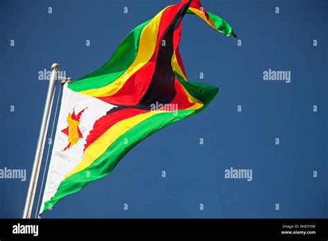Zimbabwean flag flying hi-res stock photography and images - Alamy
