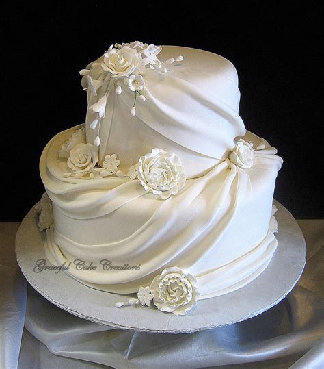 Elegant White Fondant Wedding Cake with Sugar Flowers and … | Flickr