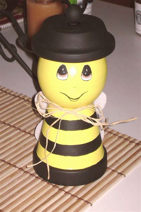 Bee candy jars that I made for my daughters cheerleading group that made bee | Clay pot crafts ...