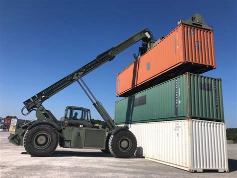 101st Airborne Cargo Handlers stacking containers.