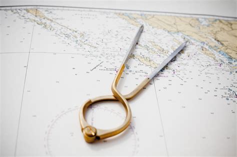 Pair of compasses for navigation on a sea map | Sea map, Compass design, Navigation