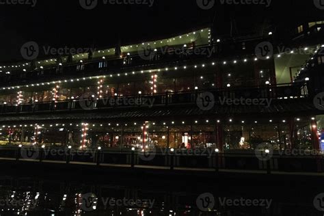 amsterdam canal at night view floating restaurant 20233696 Stock Photo at Vecteezy