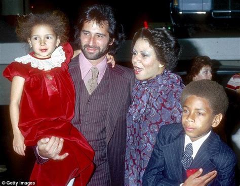 Singer Minnie Riperton with her husband, music producer Richard Rudolph, who holding a young ...